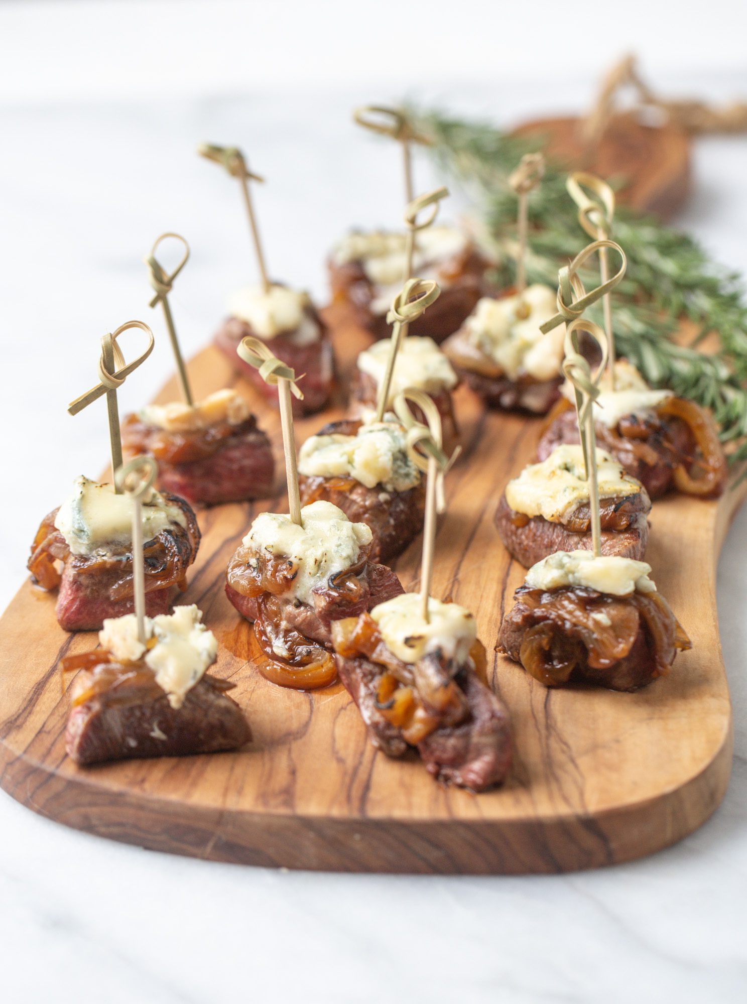 Tenderloin Bites with Blue Cheese and Caramalized Onions - TableandDish